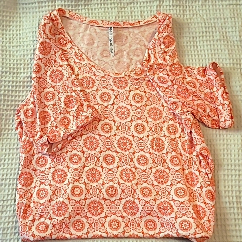 Leo & Nicole orange top.  Designed in Minneapolis Minnesota.